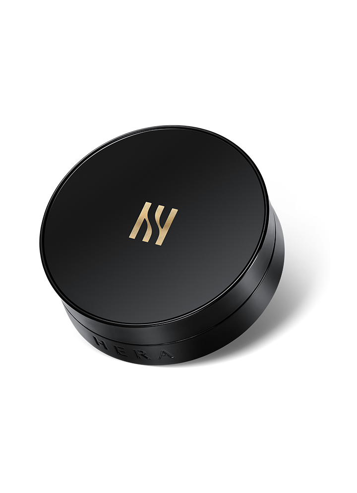 Hera Black Cushion Foundation SPF34 Amber 25N1 — black compact with puff applicator on light background