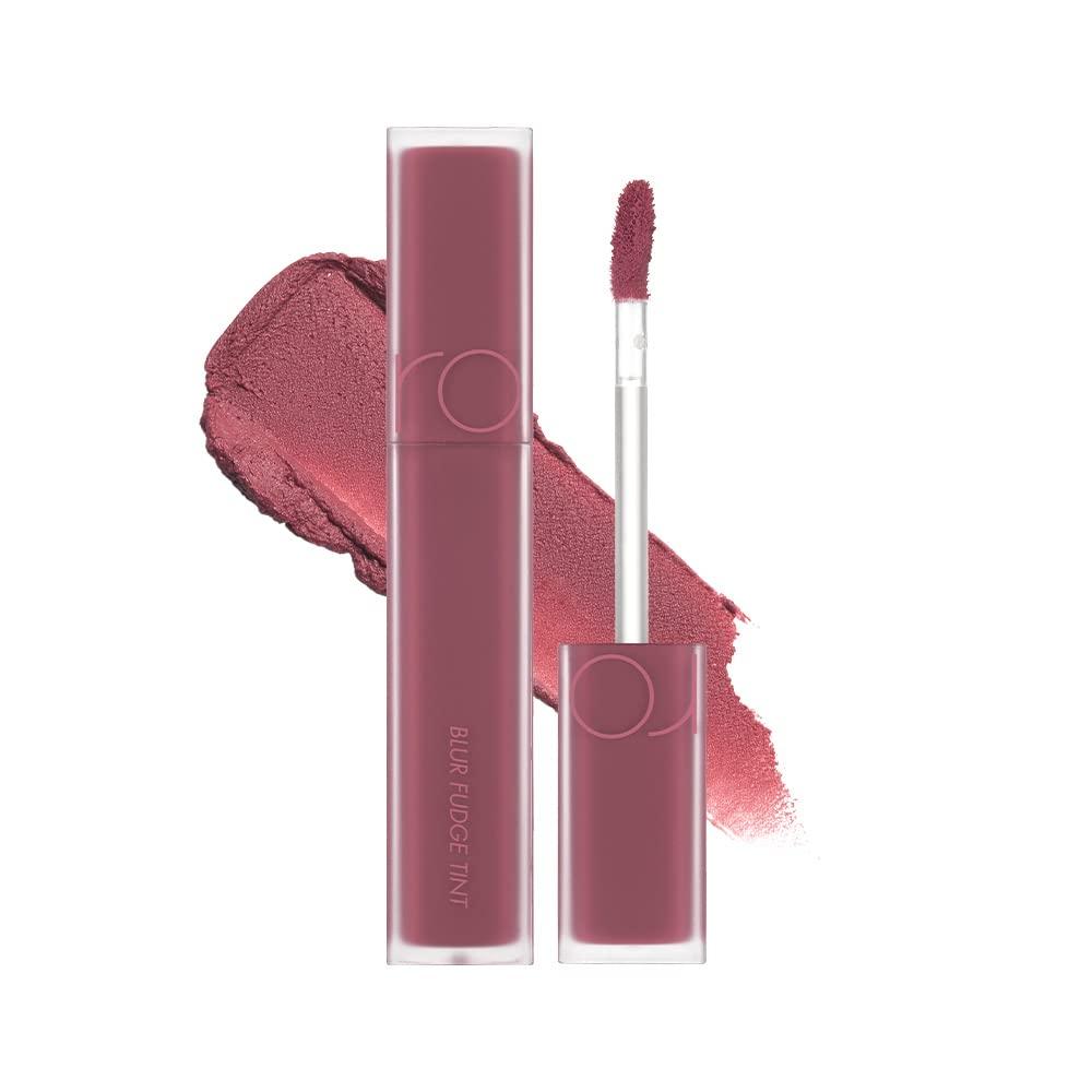 Romand Blur Fudge Tint 5g — lifestyle flat lay with flowers and multiple tint shades