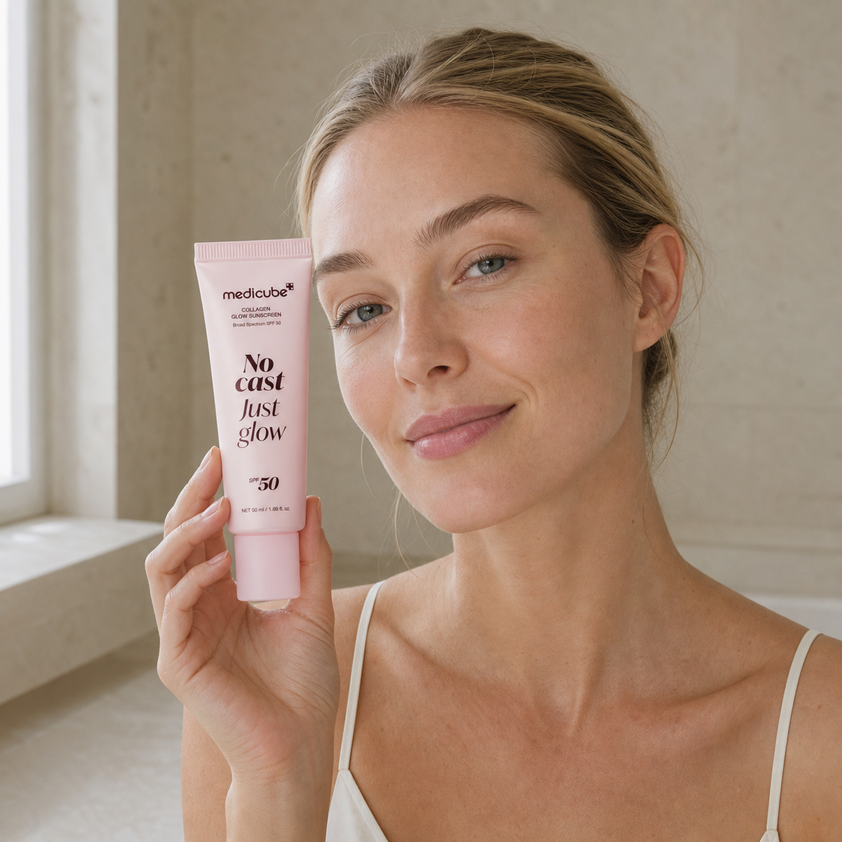 [Medicube] Collagen Glow Sunscreen 50ml - Nordic person lifestyle PDP image