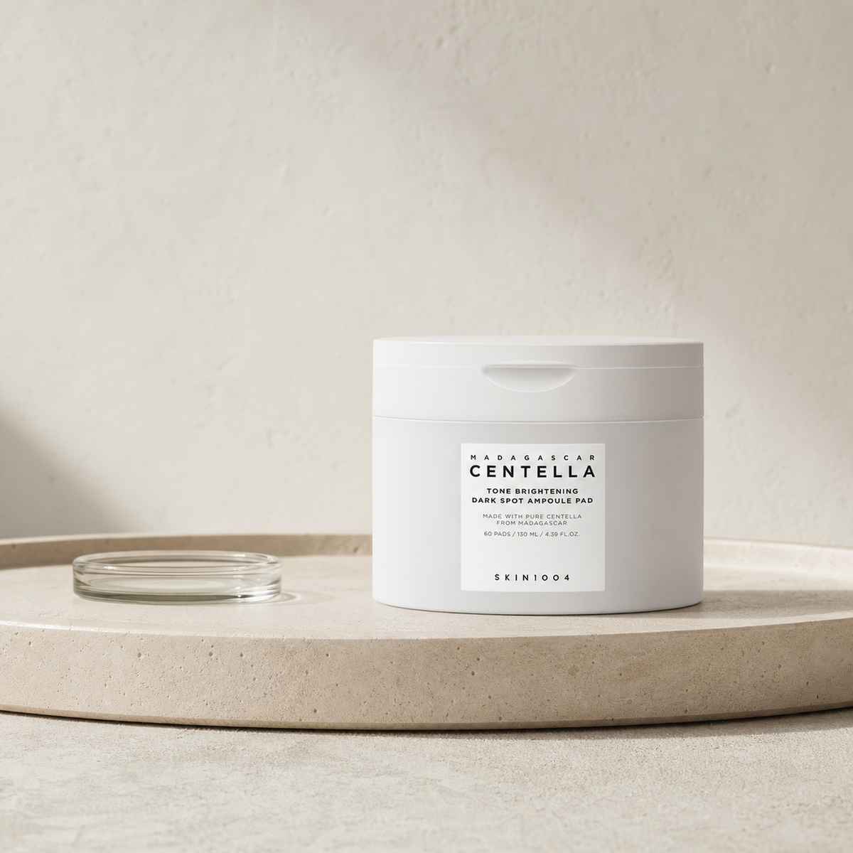 [SKIN1004] Madagascar Centella Tone Brightening Dark Spot Ampoule Pad 60pads - Routine still life PDP image