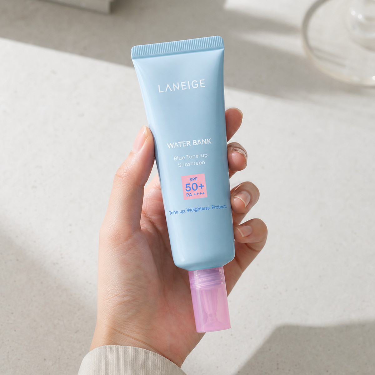 [Laneige] Water Bank Blue Tone-Up Sun Cream SPF50+ PA++++ 50ml - Hand scale moment PDP image
