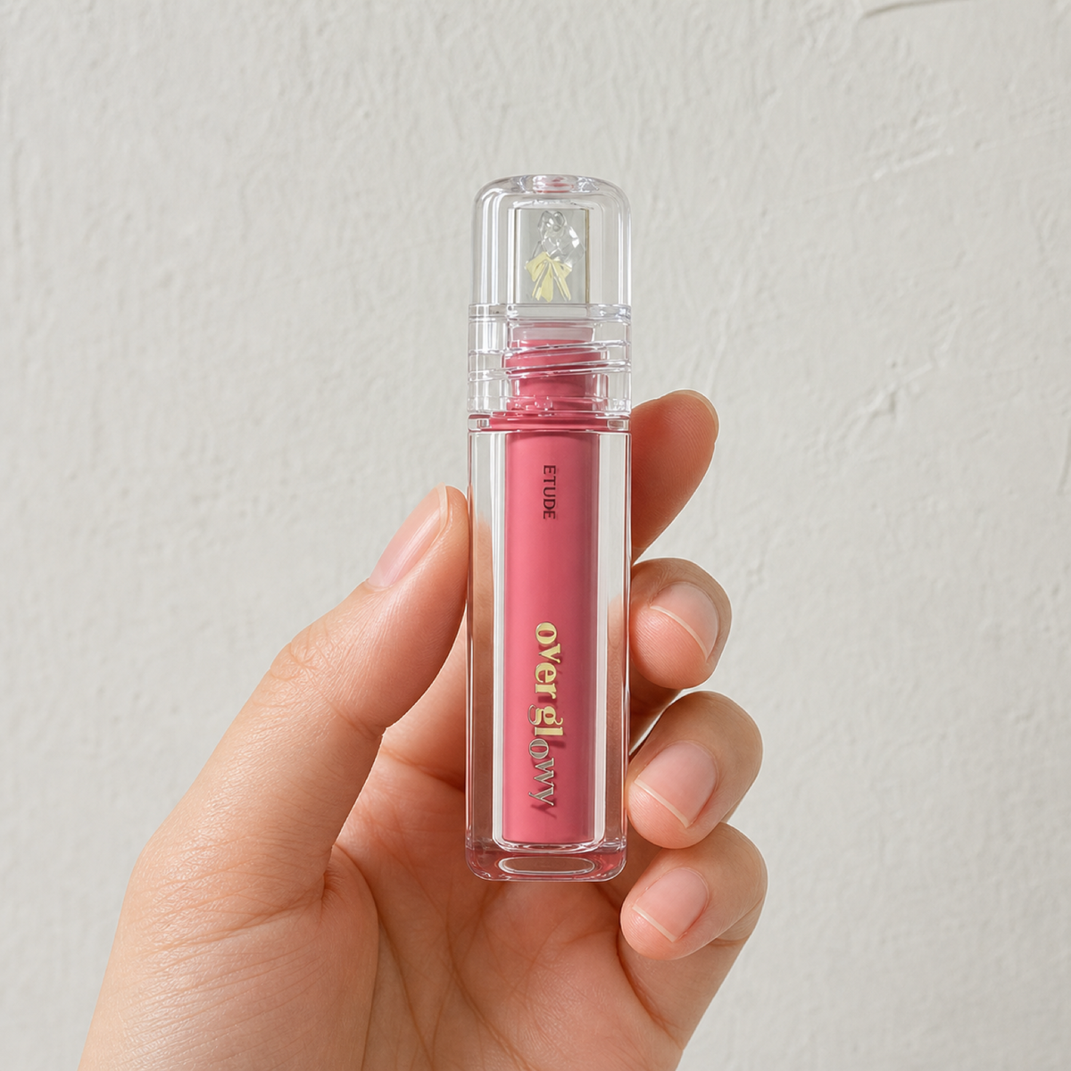 [Etudehouse] Over Glowy Gloss 3g - Taro Berry - Hand scale moment PDP image