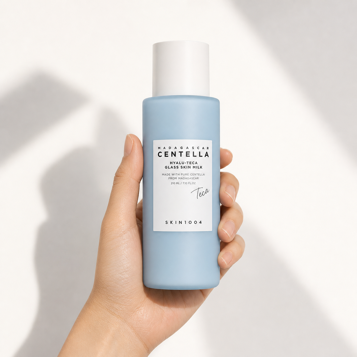 [SKIN1004] Madagascar Centella Hyalu-Teca Glass Skin Milk 210ml - Hand scale moment PDP image