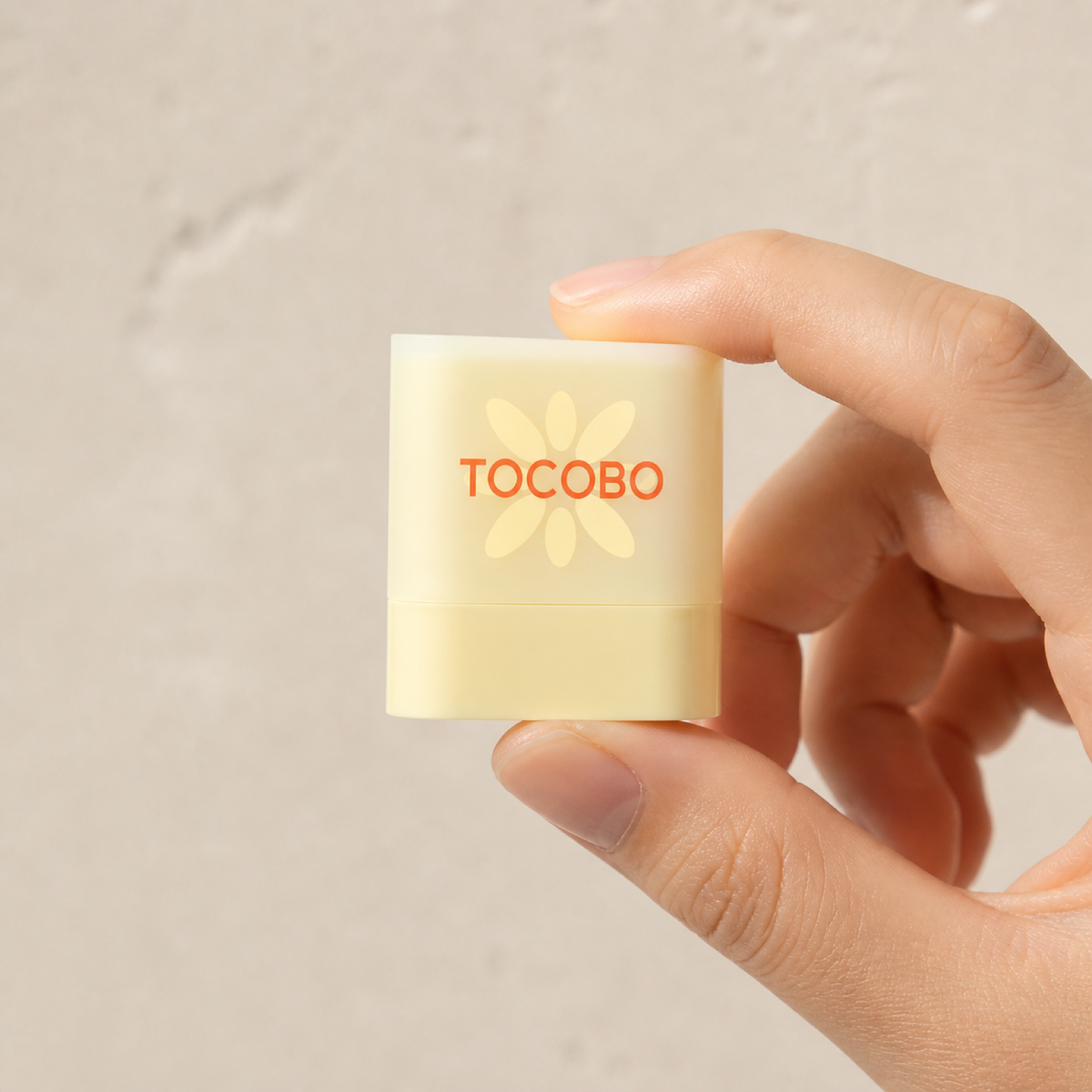 [Tocobo] Waterproof Sun Stick Mini 10g - Hand scale moment PDP image