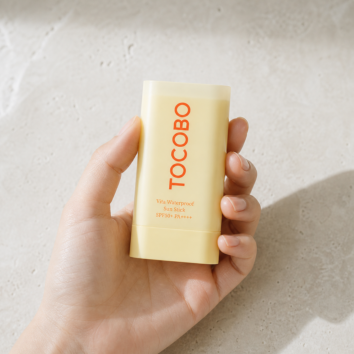 [Tocobo] Vita Waterproof Sun Stick 18g - Hand scale moment PDP image