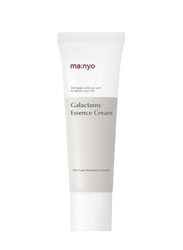Ma:nyo Galactomy Essence Cream 50ml — white glass jar with gold lid on marble surface