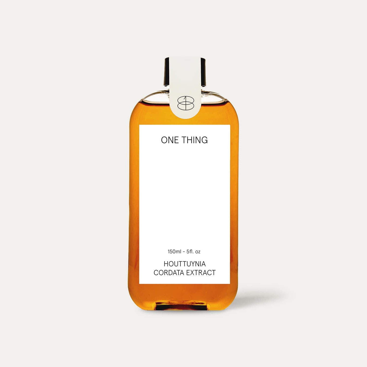 Onething Houttuynia Cordata Extract 150ml — amber glass bottle on wooden surface