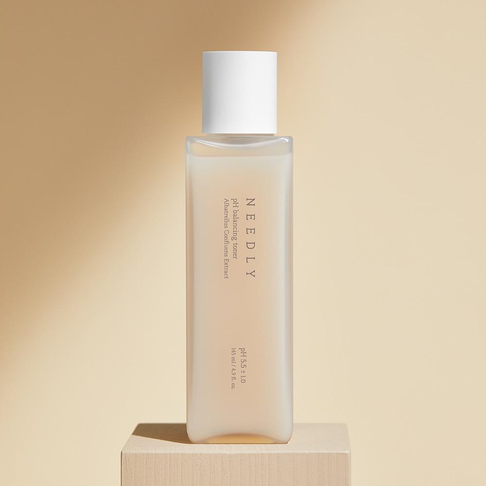 Needly pH Balancing Toner 145ml — slim bottle with pump dispenser on neutral background