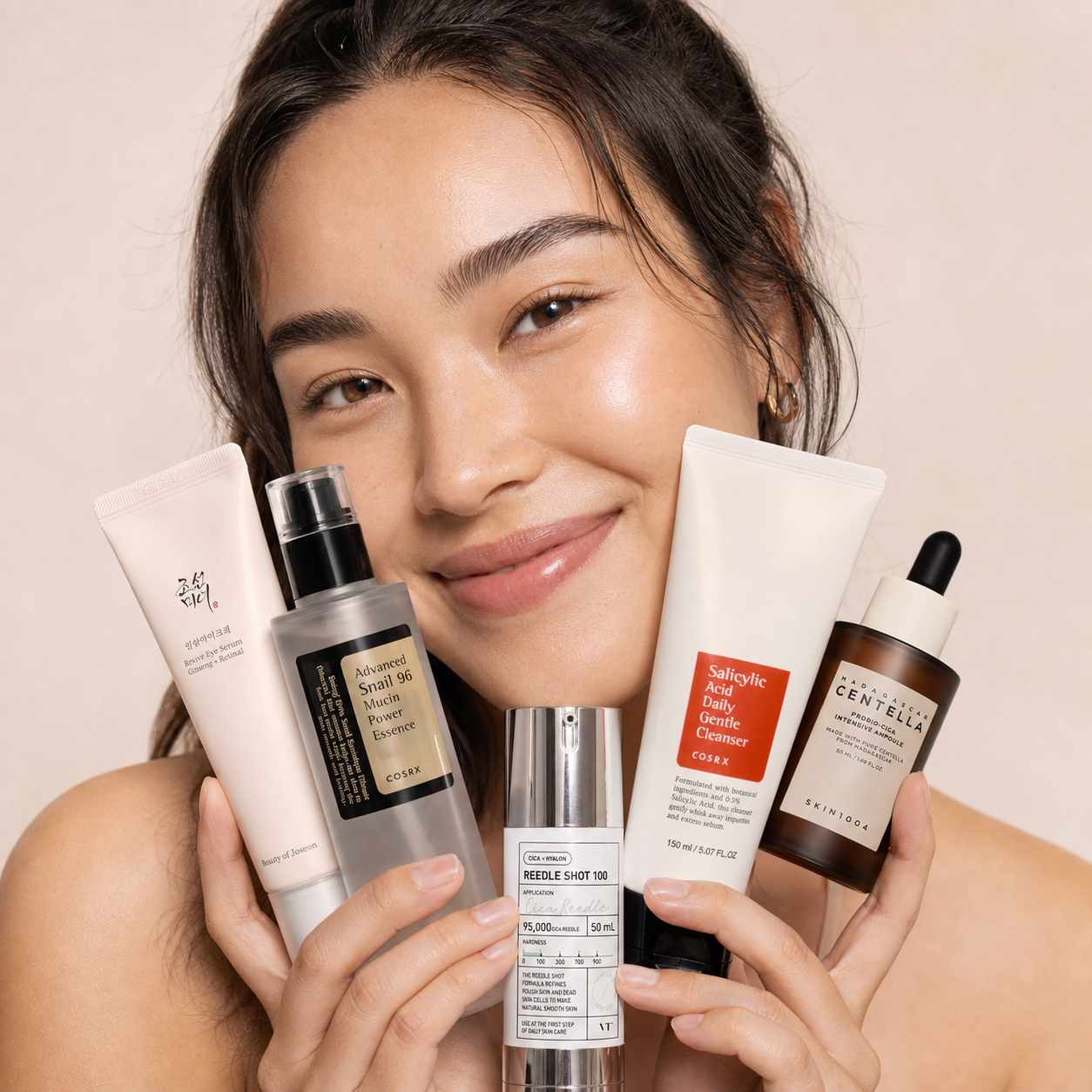 Korean-Swedish woman holding Beauty of Joseon, COSRX, VT Cosmetics, and SKIN1004 skincare